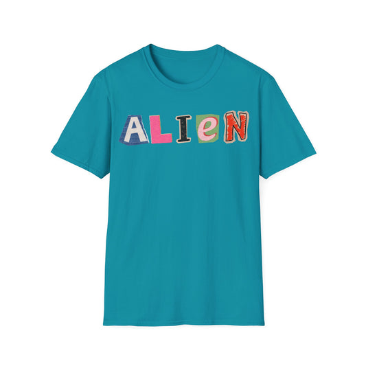 Alien Letter Cuts t-shirt design, featuring the word “ALIEN” assembled from mismatched colorful cutout letters in a playful ransom-note collage style on a tropical blue background