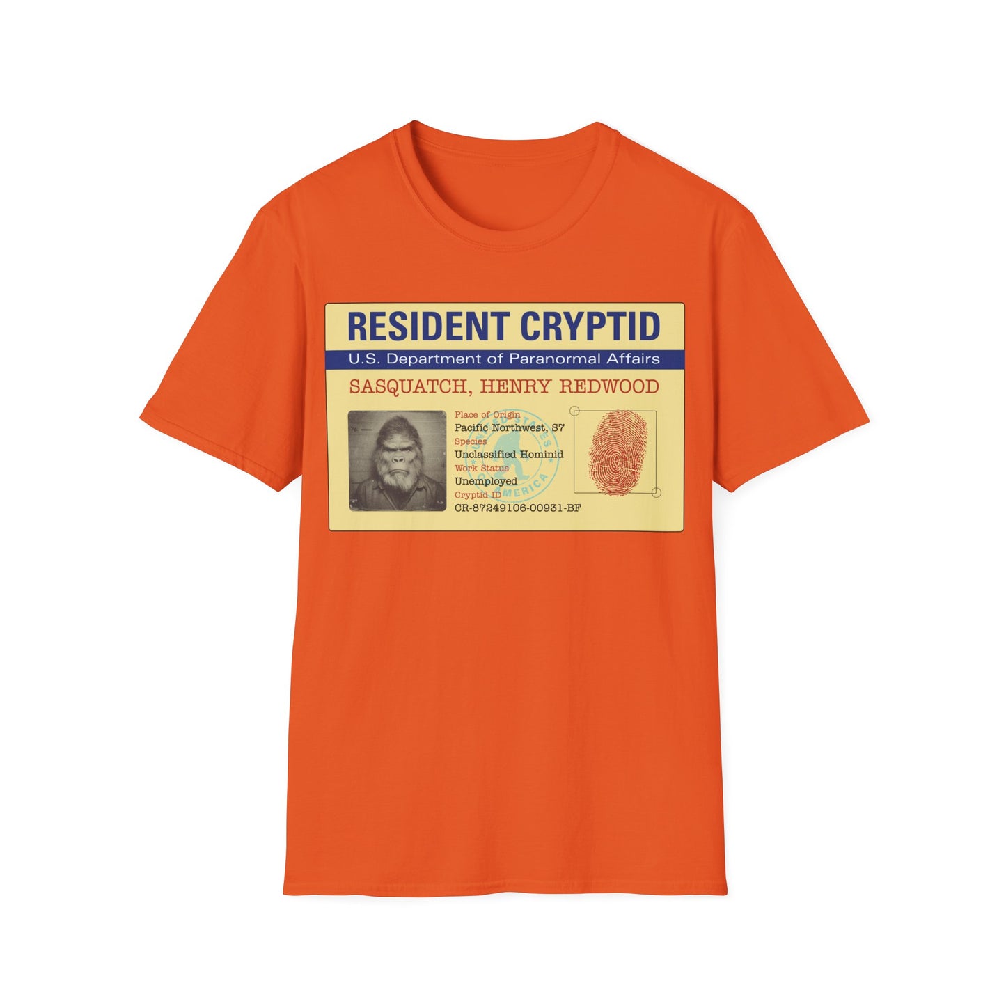 Resident Cryptid ID Card t-shirt design featuring a vintage government style Sasquatch/Bigfoot ID badge with mugshot portrait, fingerprint, and ‘U.S. Department of Paranormal Affairs’ dossier text in beige, blue, and red on an orange background