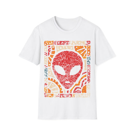 Art deco alien design with red alien face and bold geometric sunburst mosaic patterns in yellow, orange and cream on white t-shirt