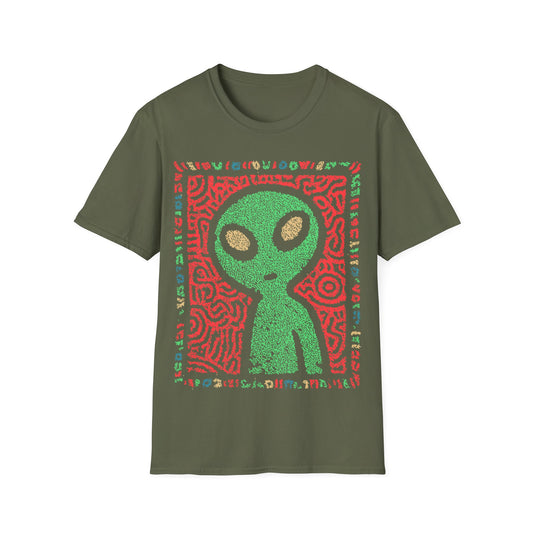Cute alien folk art design with green alien figure on red tribal patterned background and colorful glyph border on green t-shirt