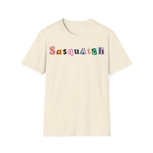 Sasquatch Letter Cuts t-shirt design, featuring the word “SASQUATCH” assembled from mismatched colorful cutout letters in a playful ransom-note collage style on a natural white background
