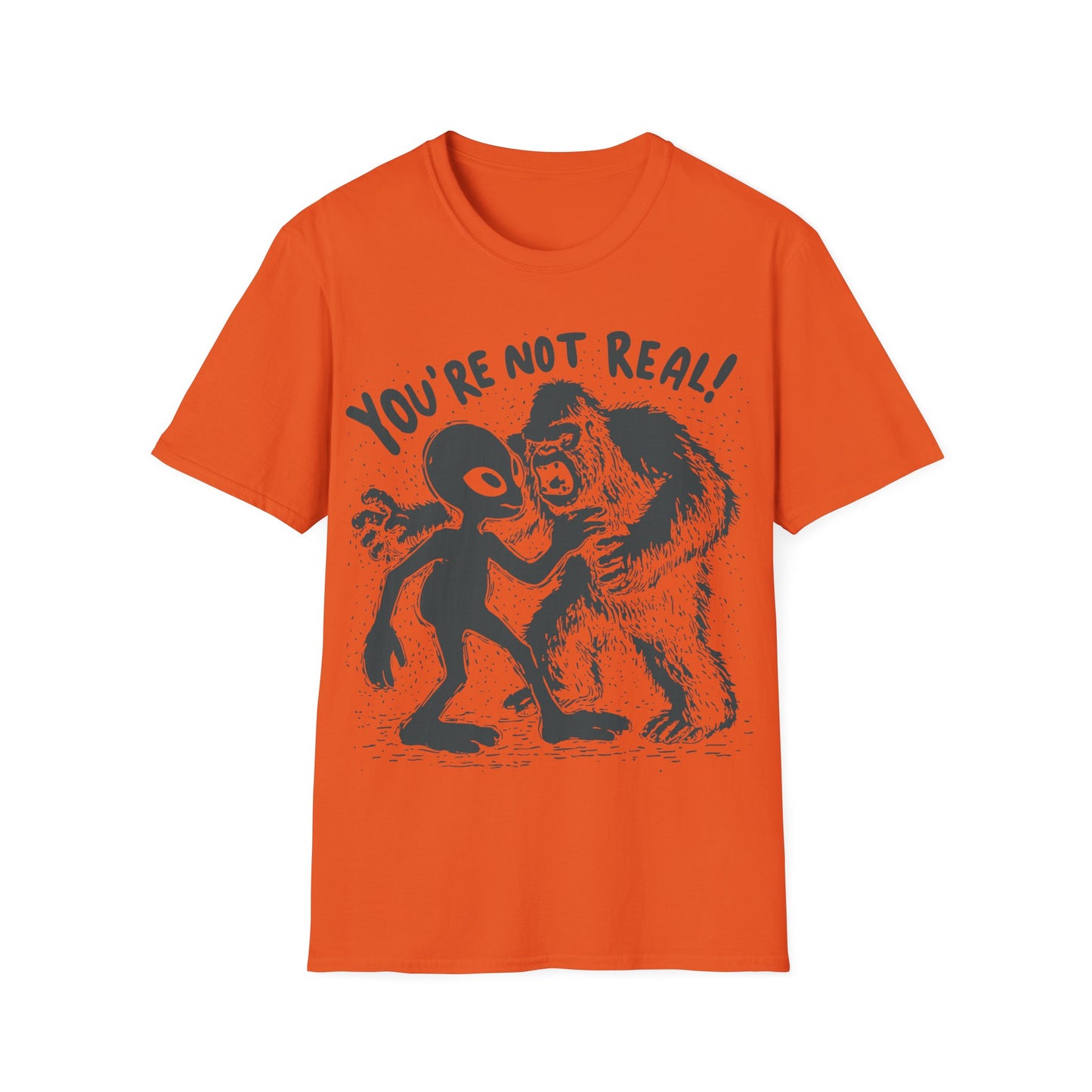 Funny alien and Bigfoot design with cartoon alien arguing with roaring sasquatch under the slogan You're Not Real on orange t-shirt