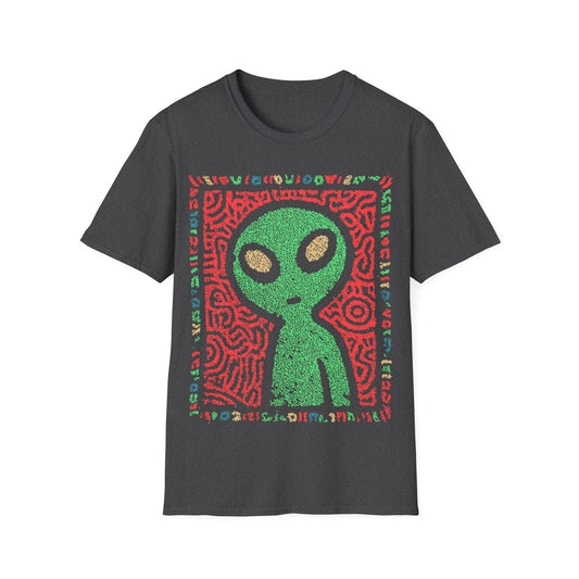 Cute alien folk art design with green alien figure on red tribal patterned background and colorful glyph border on dark gray t-shirt