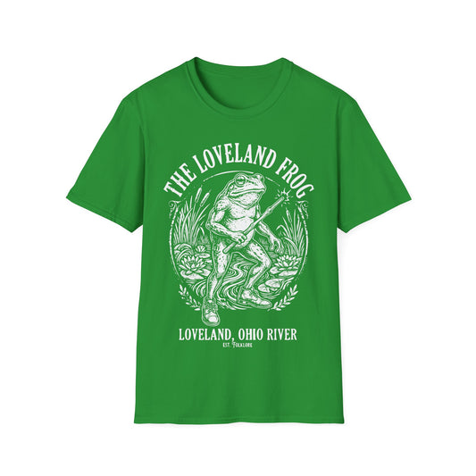Loveland Frog t-shirt design, featuring a humanoid frog holding a glowing wand in a marsh filled with reeds and lily pads, framed by bold “The Loveland Frog” and “Loveland, Ohio River” lettering in a detailed vintage folklore illustration on an irish green background