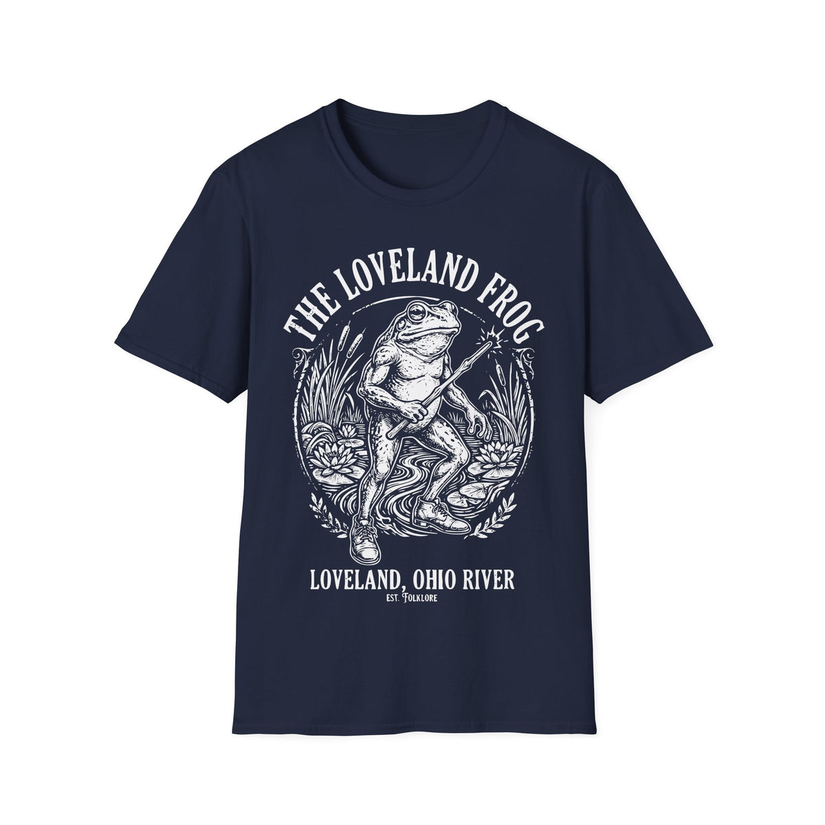Loveland Frog t-shirt design, featuring a humanoid frog holding a glowing wand in a marsh filled with reeds and lily pads, framed by bold “The Loveland Frog” and “Loveland, Ohio River” lettering in a detailed vintage folklore illustration on a navy blue background