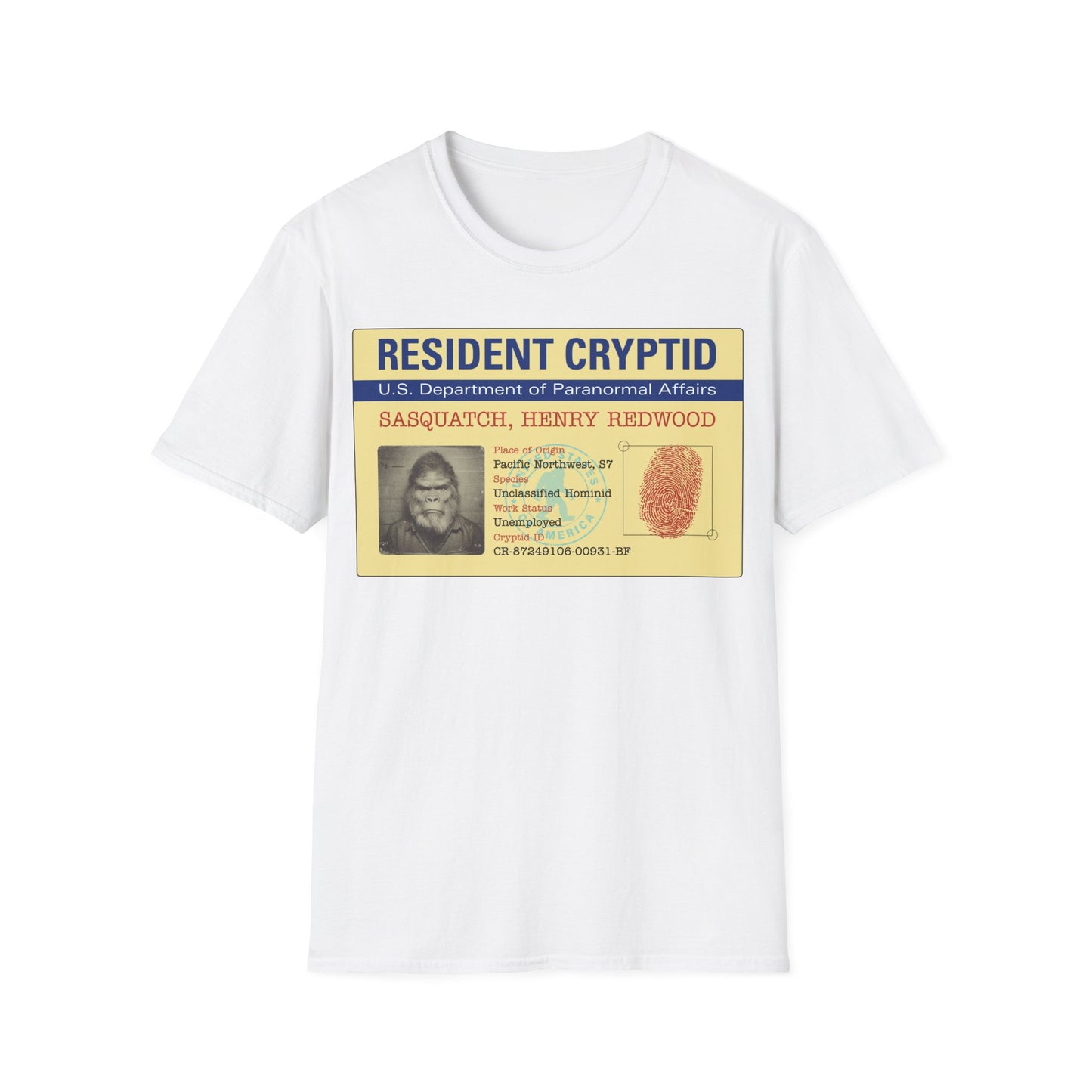 Resident Cryptid ID Card t-shirt design featuring a vintage government style Sasquatch/Bigfoot ID badge with mugshot portrait, fingerprint, and ‘U.S. Department of Paranormal Affairs’ dossier text in beige, blue, and red on a white background