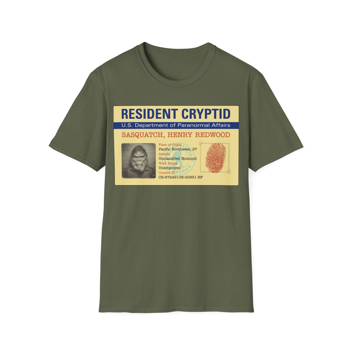 Resident Cryptid ID Card t-shirt design featuring a vintage government style Sasquatch/Bigfoot ID badge with mugshot portrait, fingerprint, and ‘U.S. Department of Paranormal Affairs’ dossier text in beige, blue, and red on a military green background