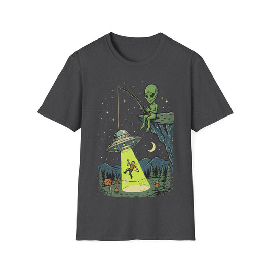 A dark gray heather crewneck t-shirt featuring a colorful graphic print of a green alien fishing from a cliffside platform with a spotlight beam directed at a campsite below.