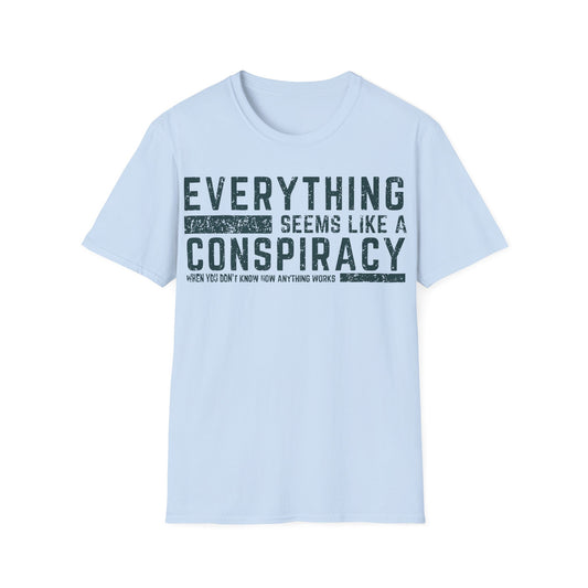 Everything Seems Like a Conspiracy t-shirt design, featuring distressed typography reading “Everything Seems Like a Conspiracy When You Don’t Know How Anything Works” on a light blue background