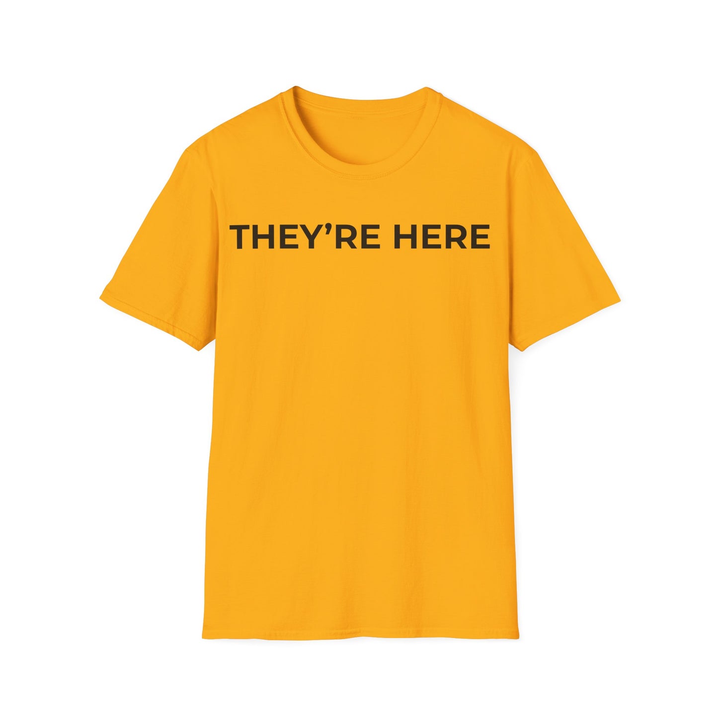 They’re Here t-shirt design, featuring bold white uppercase typography reading “THEY’RE HERE” in a clean minimalist text based layout on a gold yellow background