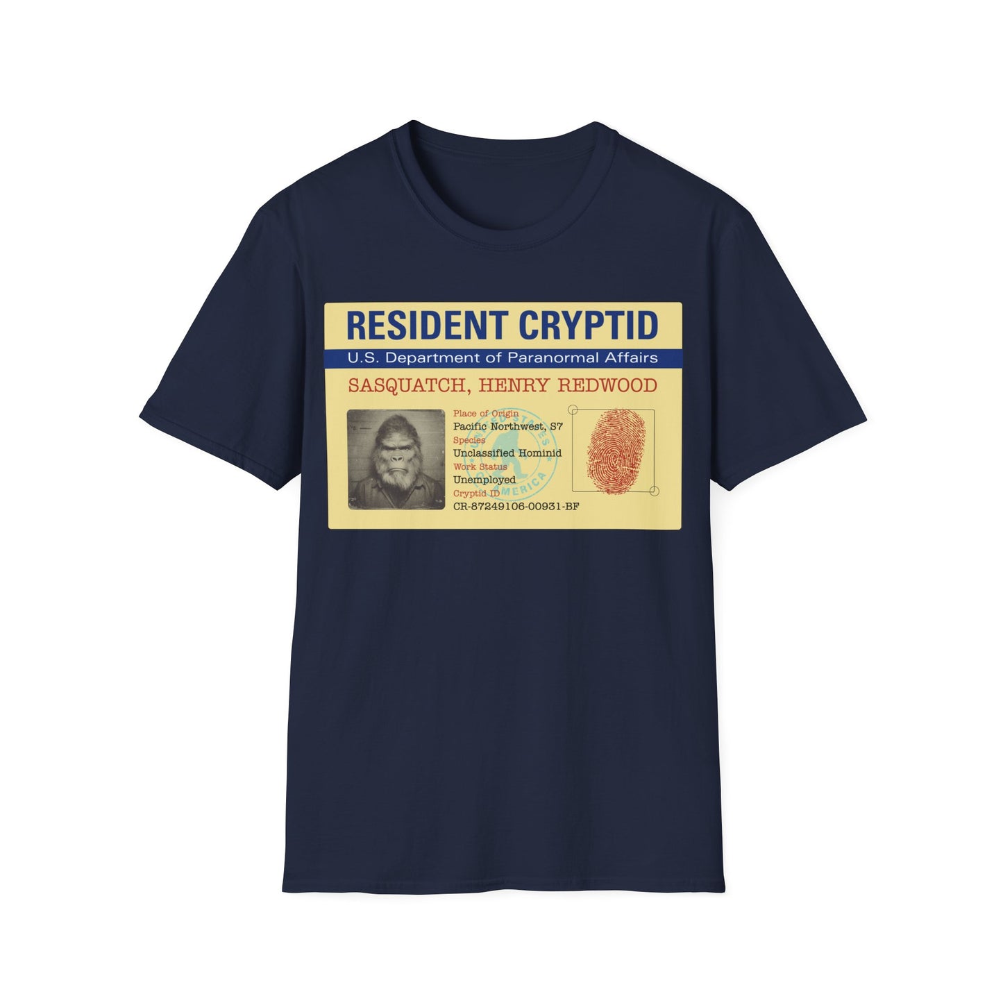 Resident Cryptid ID Card t-shirt design featuring a vintage government style Sasquatch/Bigfoot ID badge with mugshot portrait, fingerprint, and ‘U.S. Department of Paranormal Affairs’ dossier text in beige, blue, and red on a navy blue background